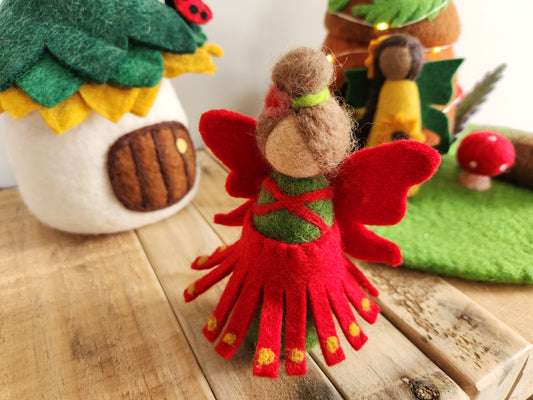 Felt Pohutukawa Fairy - Red and green Christmas Fairy with felt fairy houses in background