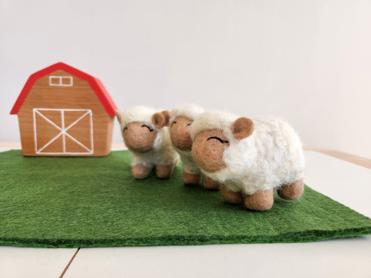 Felted Paddock Playmat with wooden farmyard barn and felt sheep toys