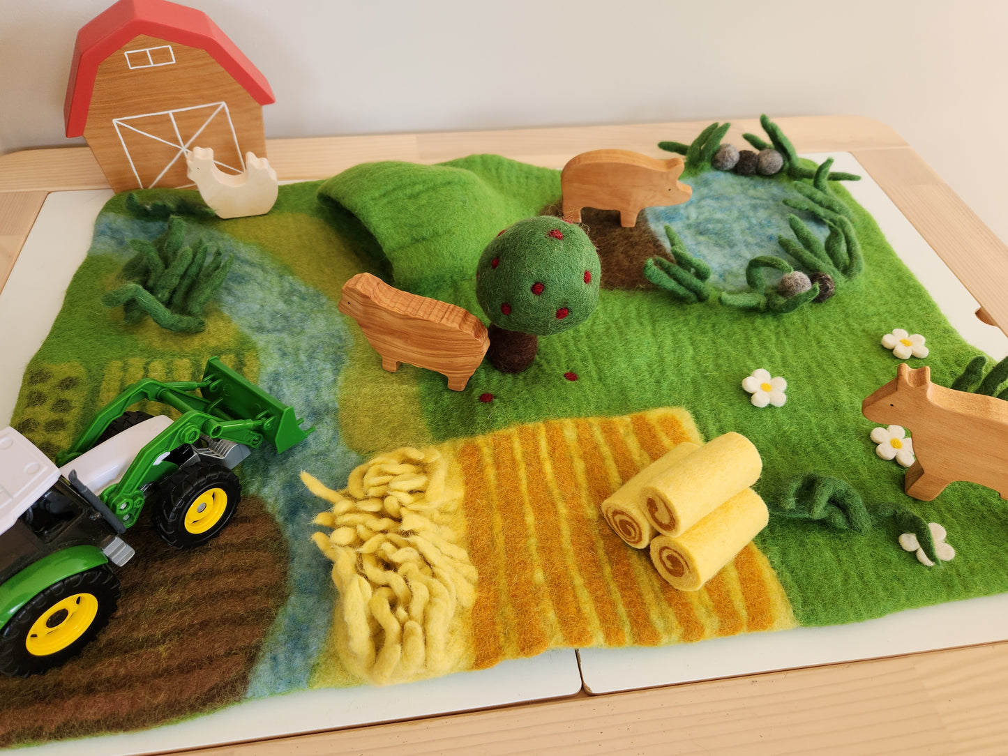 Happy Hooves - Felt Farmyard Play Mat top view with toy tractor and wooden toy animals
