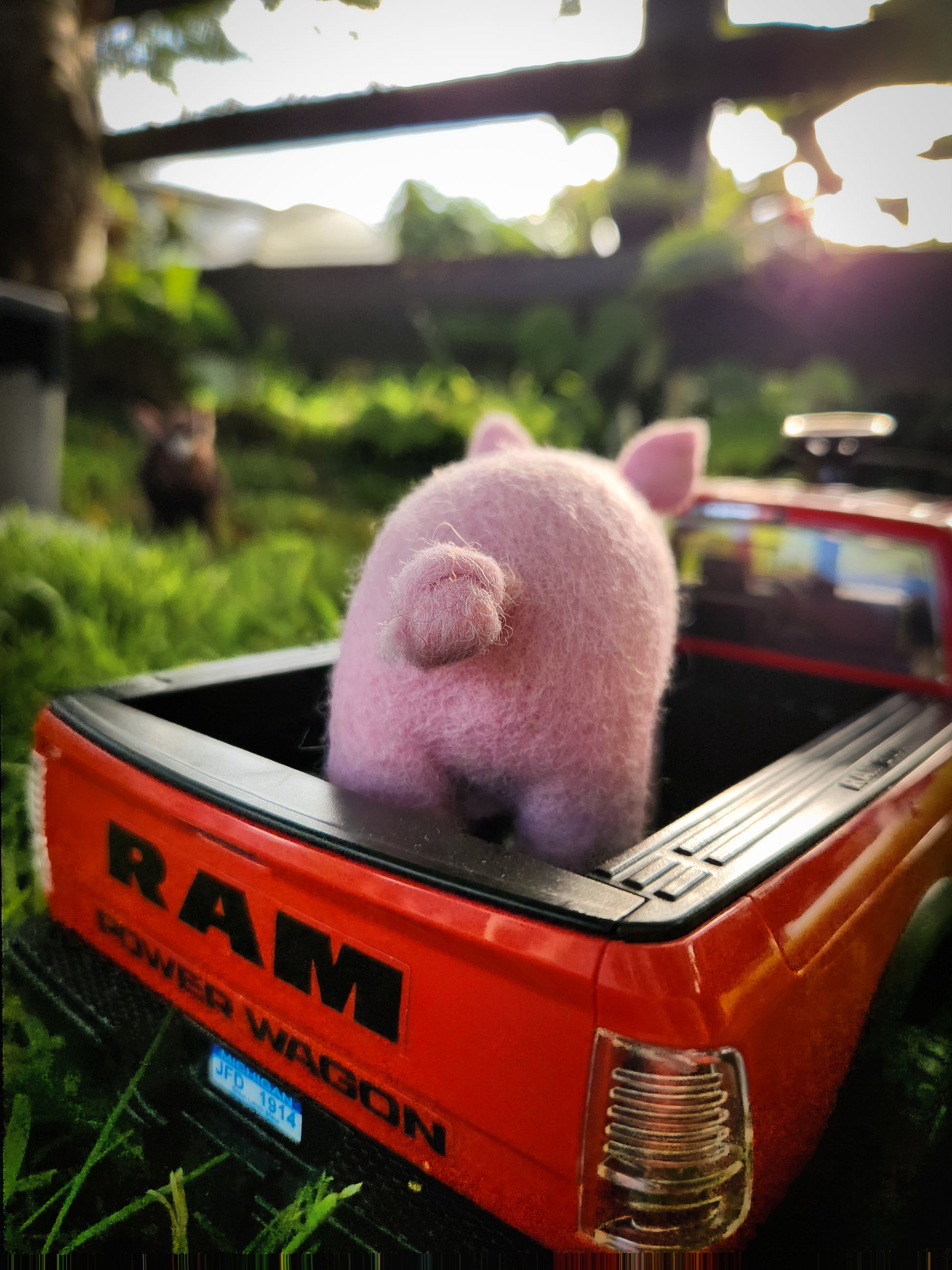 Pippa the Pig - Felt Toy Pig on back of red toy ute