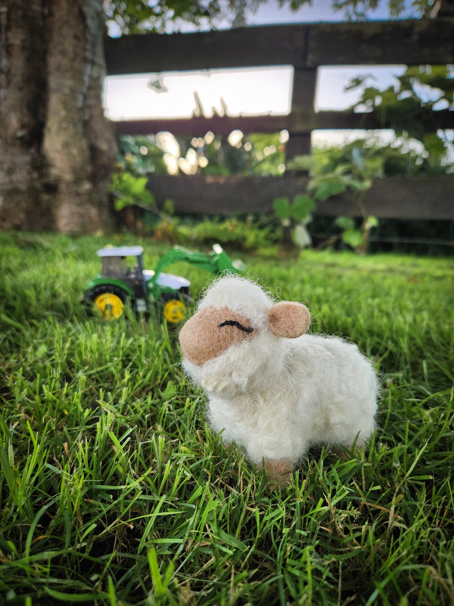 Sally the Sheep - Felt Toy Sheep in grass paddock with toy tractor