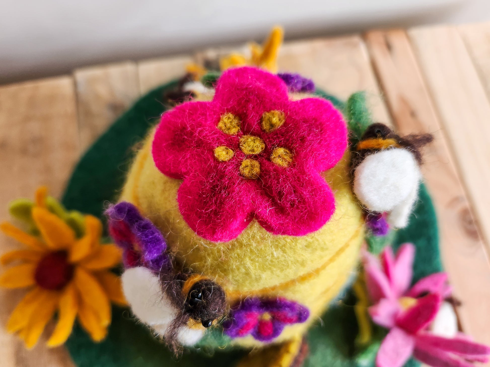 BEEHIVE FELT FAIRY HOUSE - TOP VIEW - YELLOW HOUSE WITH PINK FLOWER ON TOP