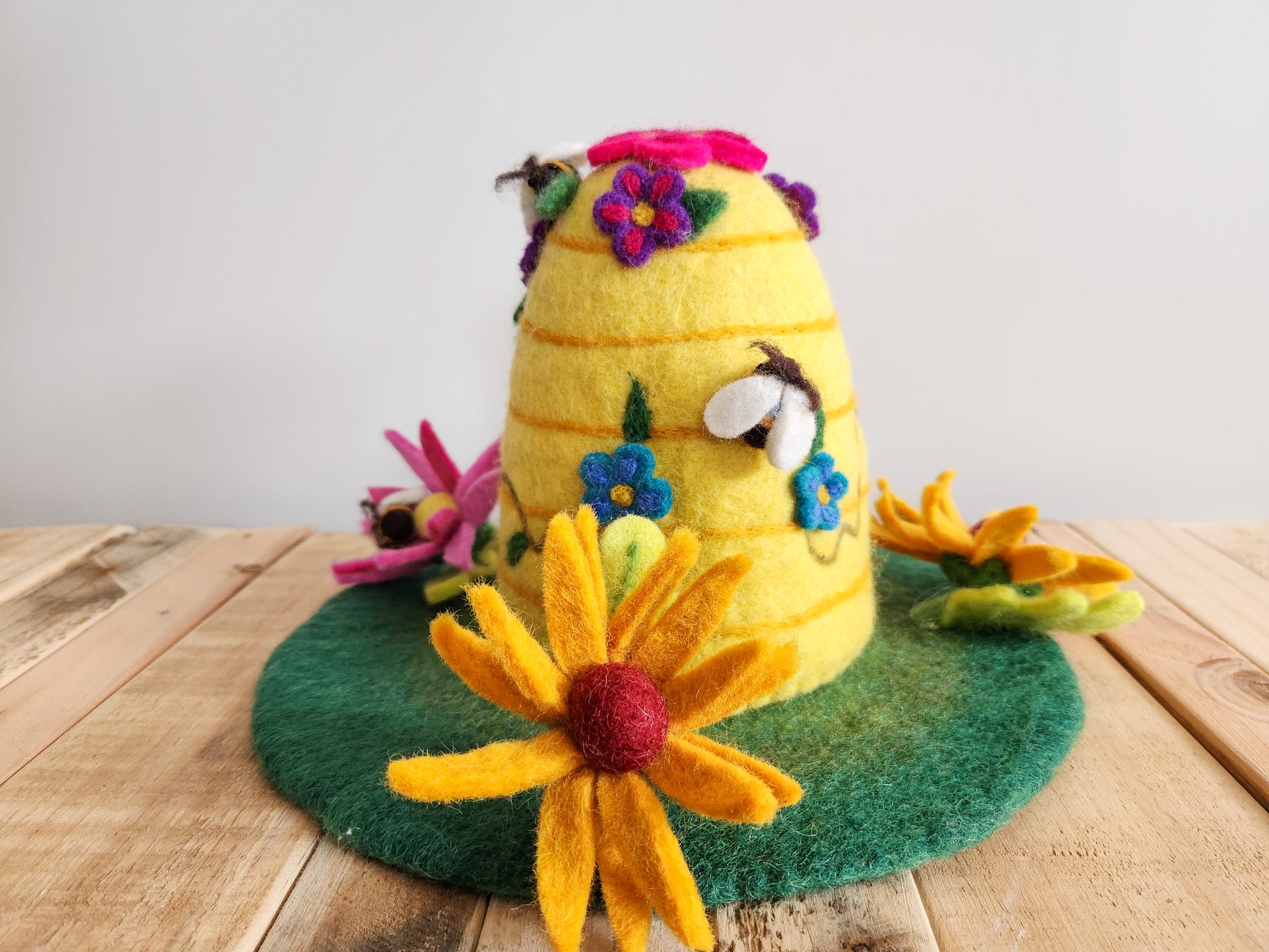 BEEHIVE FELT FAIRY HOUSE  BACK VIEW WITH FLOWER FOREST FLOOR FELT MAT, YELLOW FELT BEEHIVE HOME AND FLORAL DECORATIONS