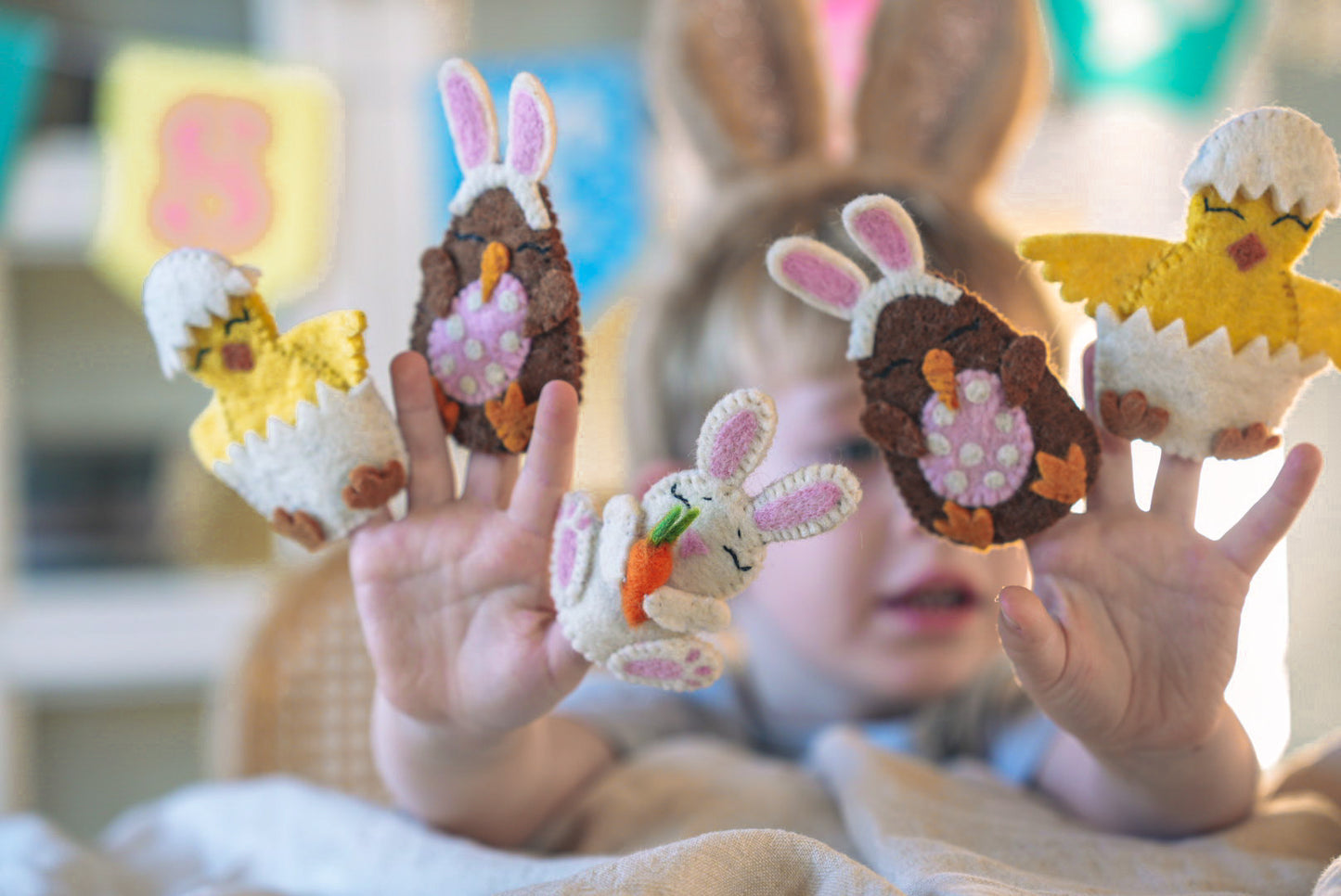 Young Boy playing with Felt Easter Finger Puppets