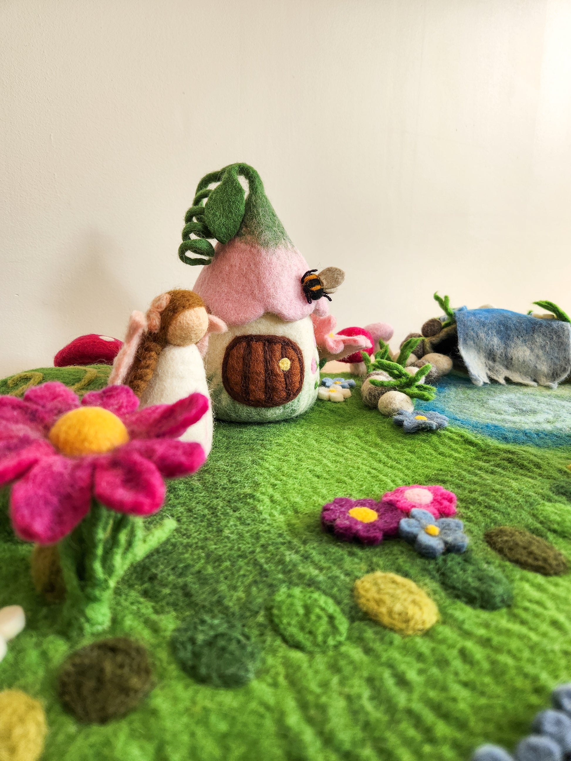 Felted Meadow Falls play mat with small bellflower bungalow fairy house and cherry blossom pink fairy