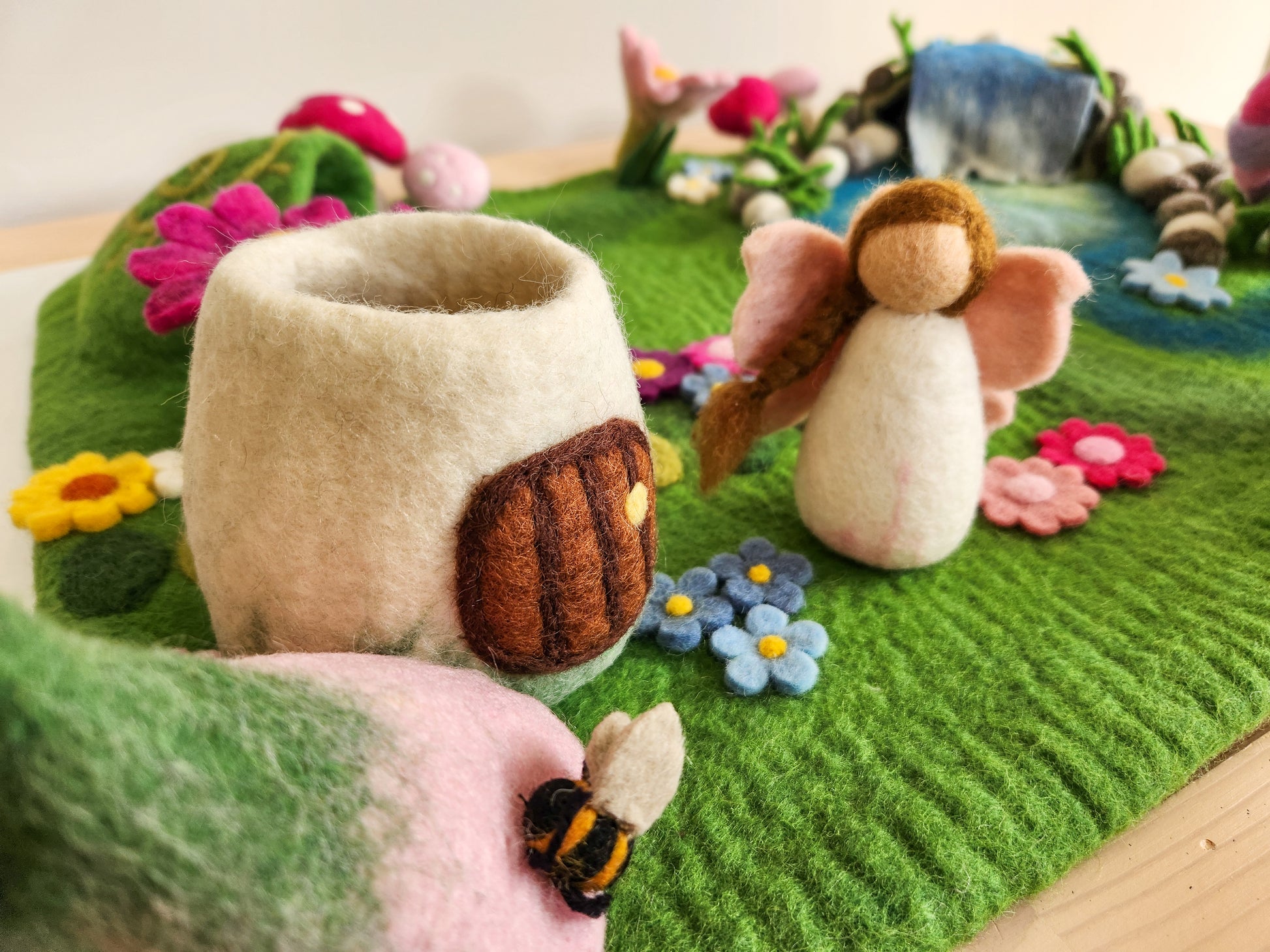 Meadow Falls felt playmat with small fairy house and fairy