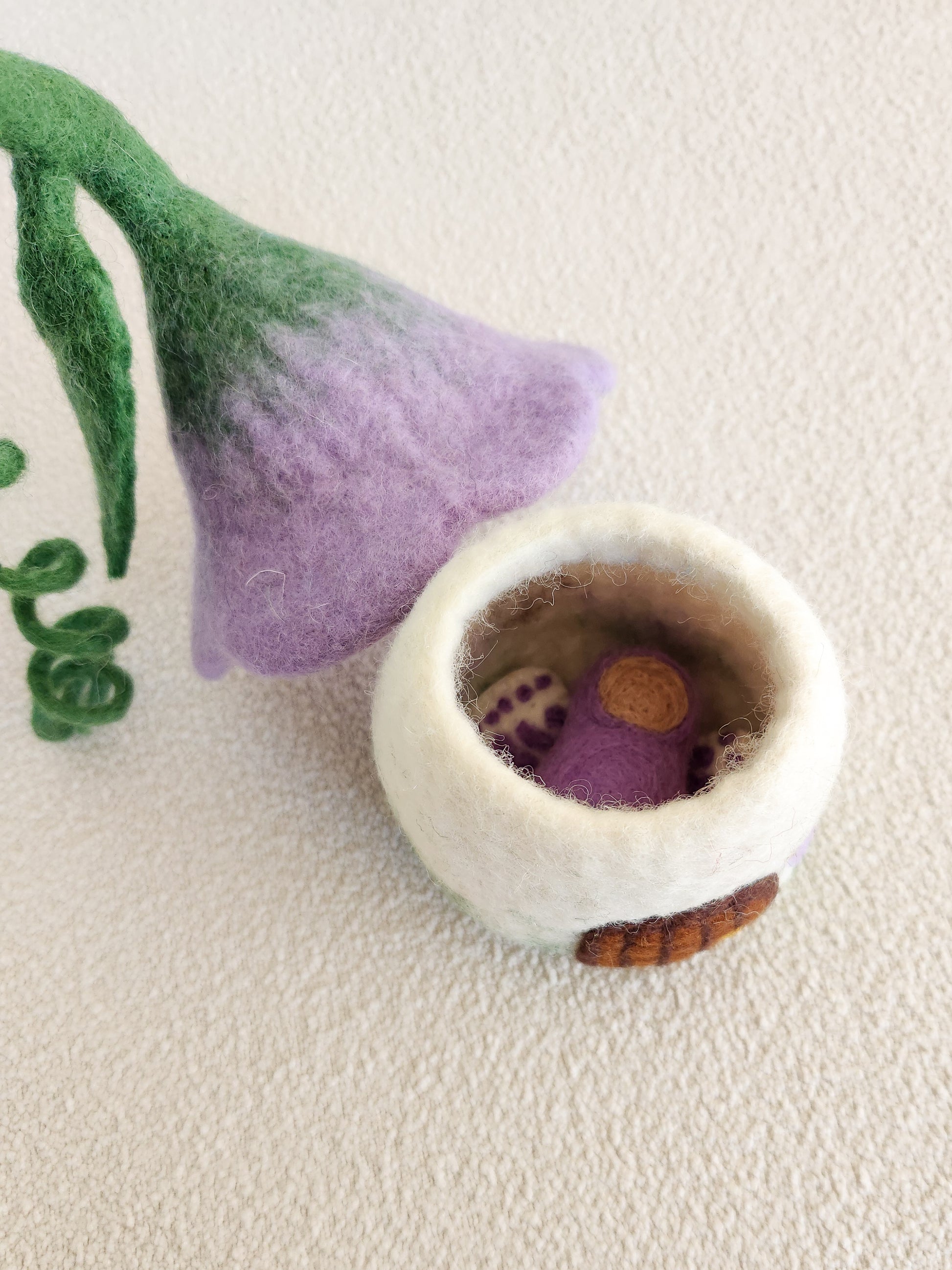 PURPLE BELLFLOWER FELT FAIRY HOUSE WITH FLOWER ROOF REMOVEDAND SMALL BABY FAIRY INSIDE